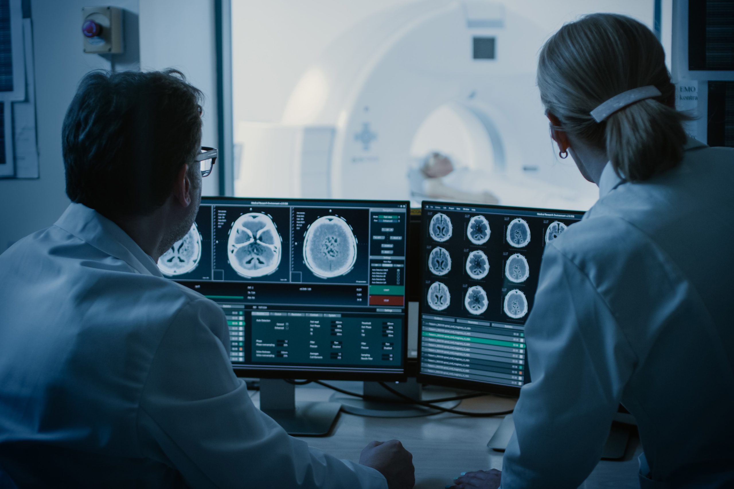 Doctors reading a scan of a patient's brain
