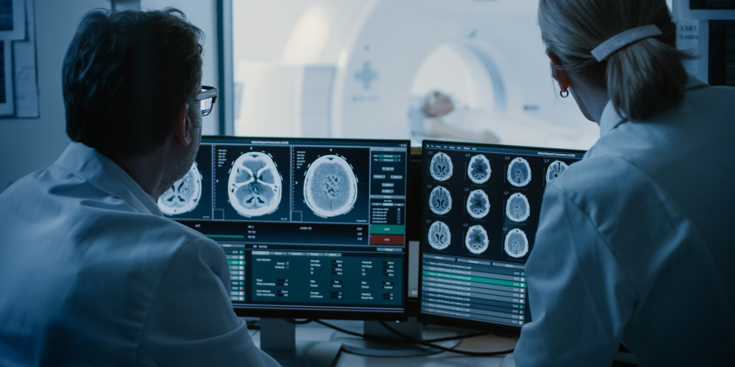 Doctors reading a scan of a patient's brain